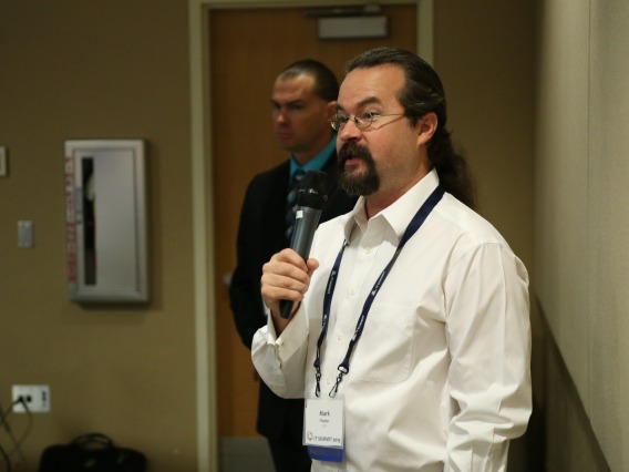A person speaking at the IT Summit