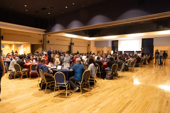 SUMC Ballroom with attendees at round tables